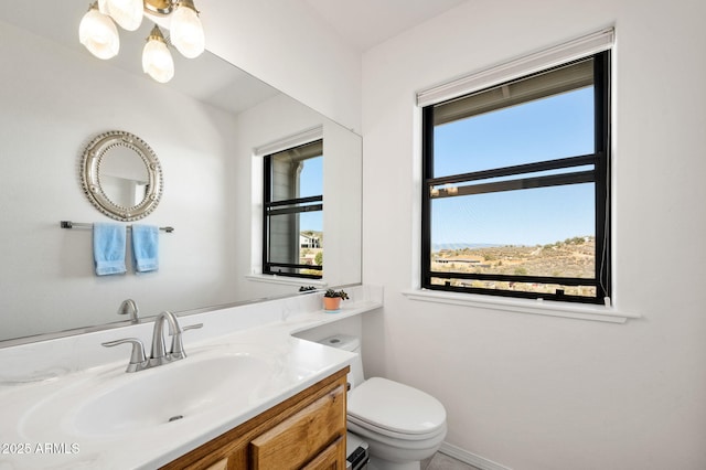 128 N French Dr, Prescott, AZ 86303 - bathroom featuring toilet, vanity, and baseboards