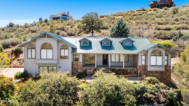 128 N French Dr, Prescott, AZ 86303 - view of front of house with stone siding, metal roof, and a porch