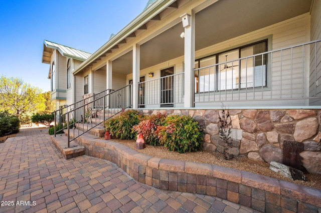 128 N French Dr, Prescott, AZ 86303 - view of home's exterior with stone siding and metal roof