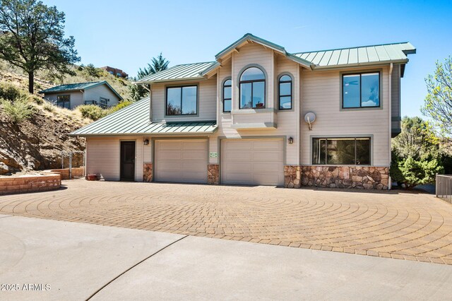 128 N French Dr, Prescott, AZ 86303 - view of front facade with a standing seam roof, metal roof, and stone siding