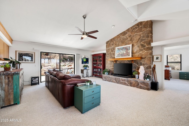 128 N French Dr, Prescott, AZ 86303 - carpeted living area with ceiling fan, a stone fireplace, and lofted ceiling