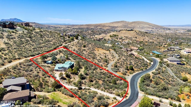 128 N French Dr, Prescott, AZ 86303 - aerial view of property's location with property parcel outlined and a mountain backdrop