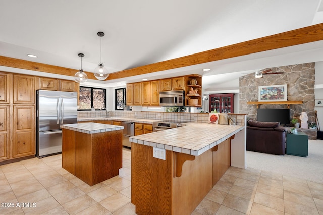 128 N French Dr, Prescott, AZ 86303 - kitchen featuring stainless steel appliances, tile counters, open shelves, brown cabinetry, and recessed lighting
