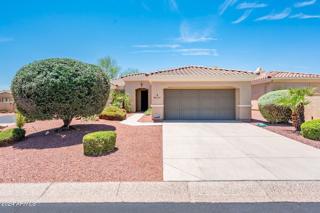 mediterranean / spanish-style home featuring a garage