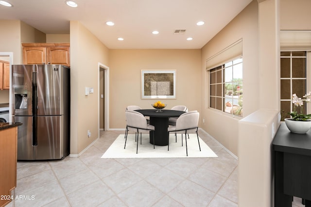 dining area with light tile patterned flooring