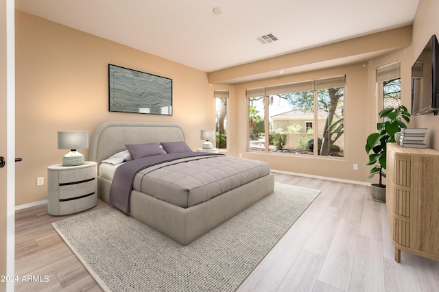 bedroom with light wood-type flooring