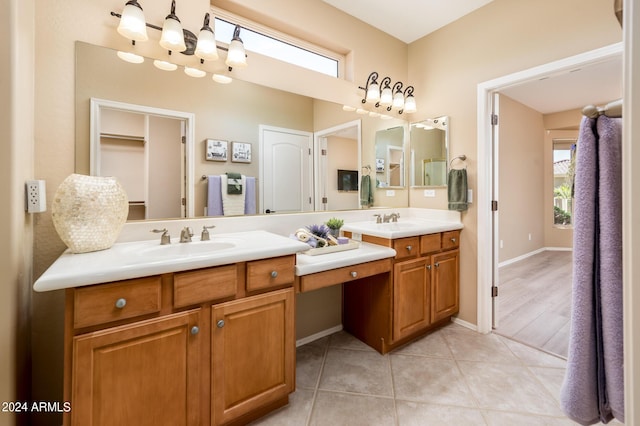 bathroom featuring tile patterned flooring and vanity