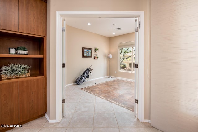 interior space with light tile patterned floors