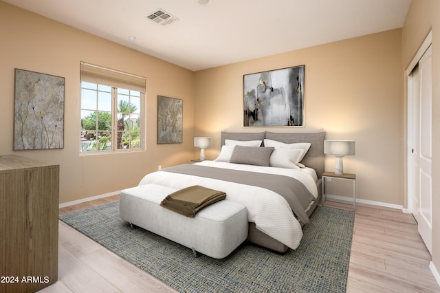 bedroom with a closet and light wood-type flooring