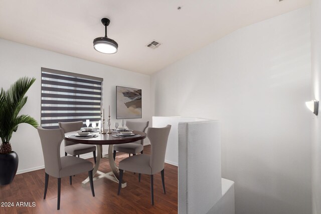 dining room with visible vents and wood finished floors