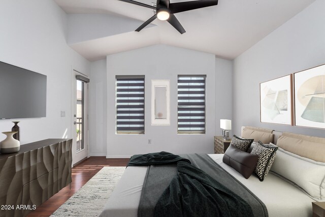 bedroom featuring dark wood finished floors, lofted ceiling, and ceiling fan