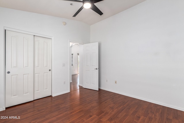 unfurnished bedroom featuring a closet, ceiling fan, and dark hardwood / wood-style floors