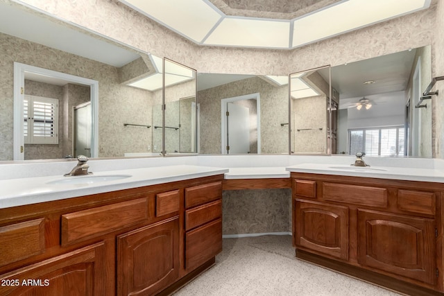 bathroom with an enclosed shower, vanity, and ceiling fan