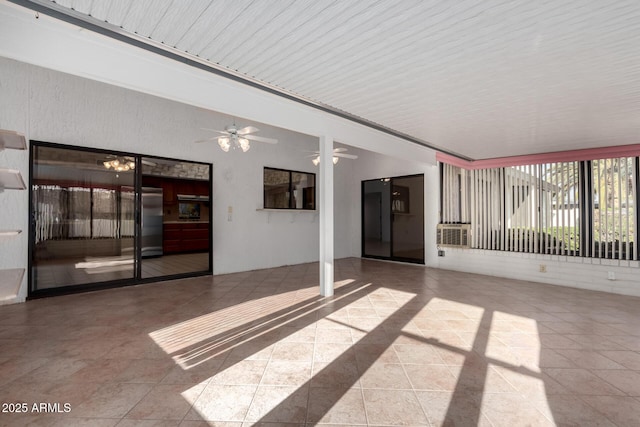 view of patio featuring ceiling fan