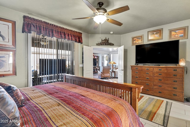 tiled bedroom with access to outside and ceiling fan