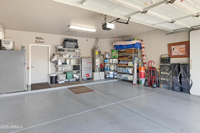 garage featuring a garage door opener, gas water heater, and stainless steel refrigerator