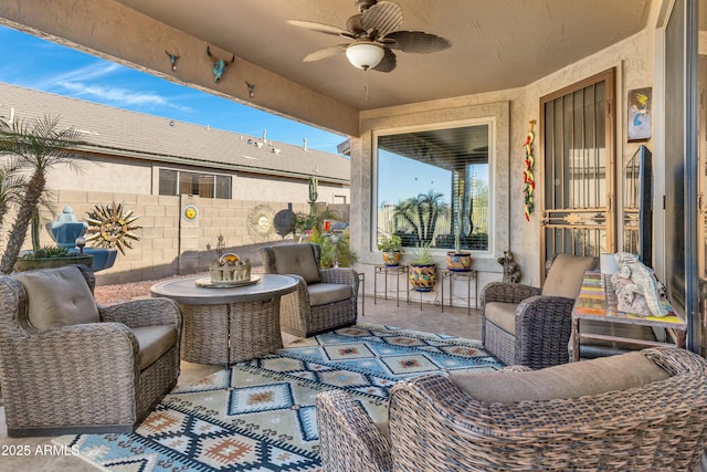 view of patio / terrace with ceiling fan and an outdoor hangout area