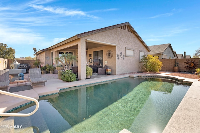 view of swimming pool with a patio area and grilling area