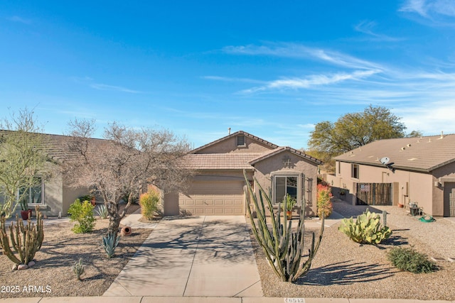 ranch-style home featuring a garage