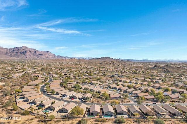 birds eye view of property featuring a mountain view