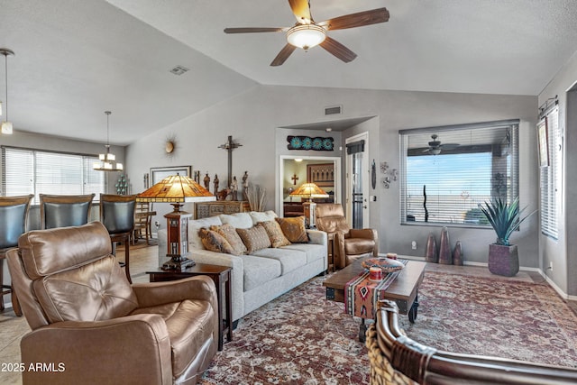 living room with a healthy amount of sunlight and lofted ceiling