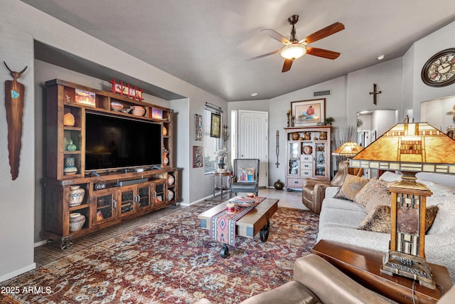 living room with ceiling fan and lofted ceiling