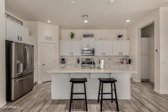 2716 S Chatsworth, Mesa, AZ 85209 - kitchen with appliances with stainless steel finishes, light countertops, white cabinetry, backsplash, and recessed lighting