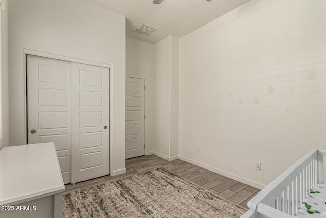 2716 S Chatsworth, Mesa, AZ 85209 - unfurnished bedroom featuring wood finished floors and a closet