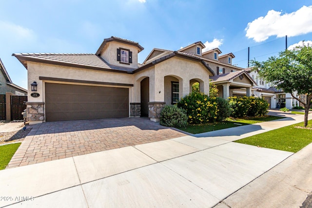2716 S Chatsworth, Mesa, AZ 85209 - view of front of property with stone siding, decorative driveway, stucco siding, and a garage