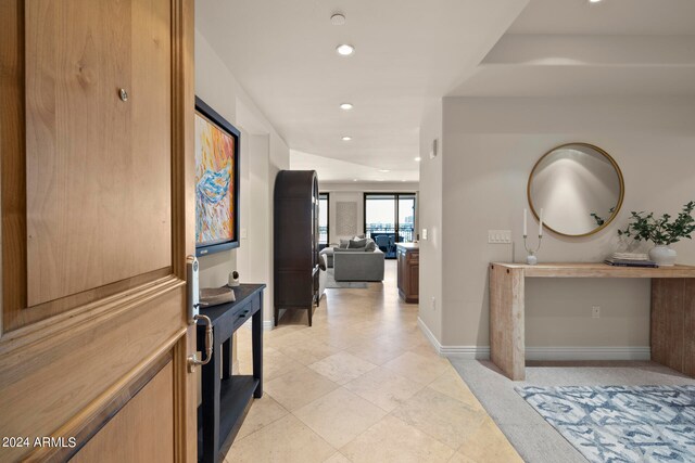 corridor featuring light tile flooring