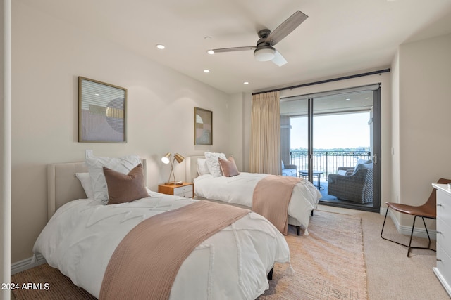 bedroom featuring light colored carpet, ceiling fan, and access to outside