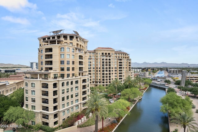 view of property featuring a water and mountain view