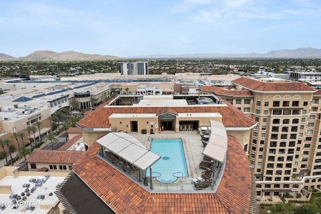 birds eye view of property with a mountain view