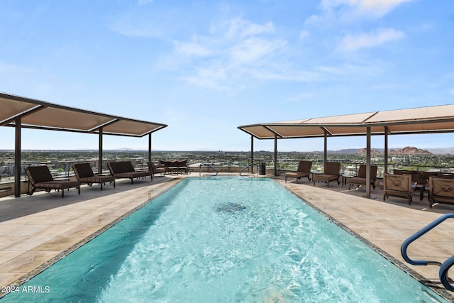 view of swimming pool with a patio