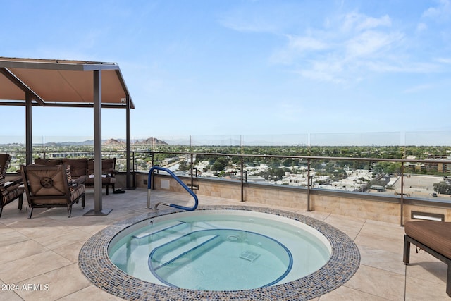 view of pool featuring an in ground hot tub and a patio