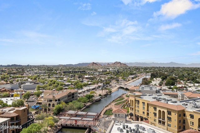 birds eye view of property with a mountain view