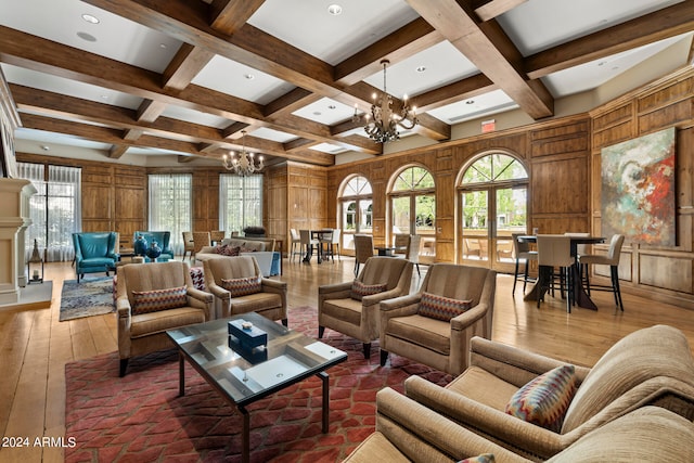 interior space with coffered ceiling, hardwood / wood-style flooring, and an inviting chandelier