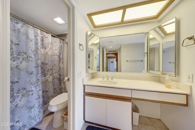 full bathroom featuring tile patterned floors, toilet, and vanity