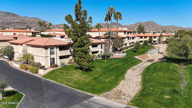 exterior space featuring a mountain view and a residential view