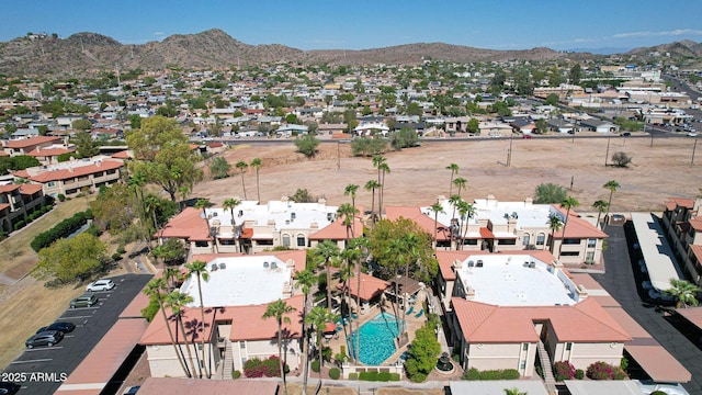 drone / aerial view featuring a residential view and a mountain view