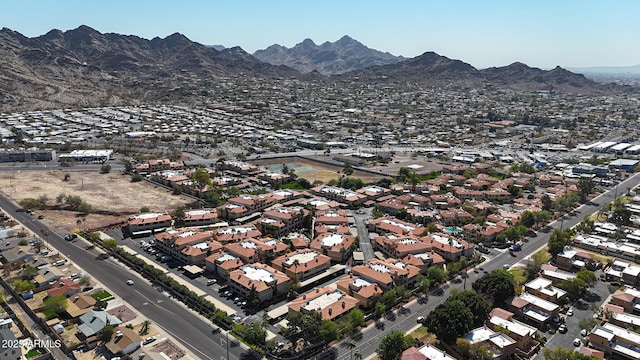 birds eye view of property with a mountain view and a residential view