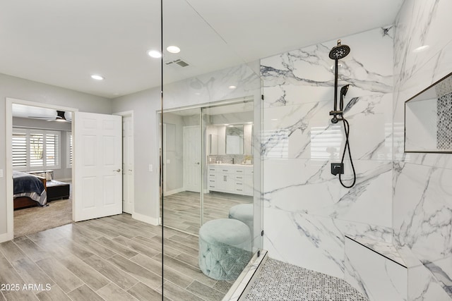 full bathroom featuring a marble finish shower, ensuite bathroom, wood tiled floor, vanity, and recessed lighting