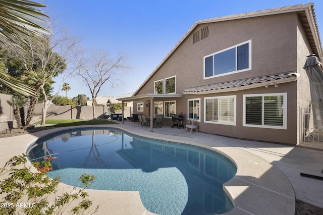 view of swimming pool featuring a fenced in pool, a patio area, and fence