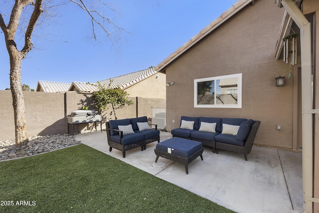 view of patio / terrace featuring fence and an outdoor hangout area