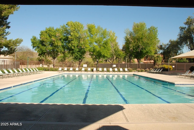 pool featuring a patio area and fence