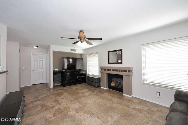1640 W Gail Dr, Chandler, AZ 85224 - living area with a ceiling fan, baseboards, and a fireplace