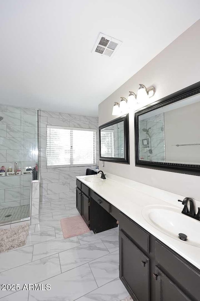 1640 W Gail Dr, Chandler, AZ 85224 - full bathroom featuring double vanity, a shower stall, and marble look tile flooring