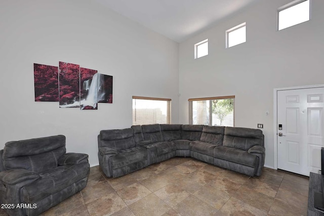 1640 W Gail Dr, Chandler, AZ 85224 - living area with stone finish floors, a high ceiling, and baseboards