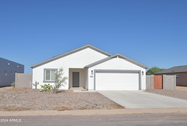 ranch-style home featuring a garage