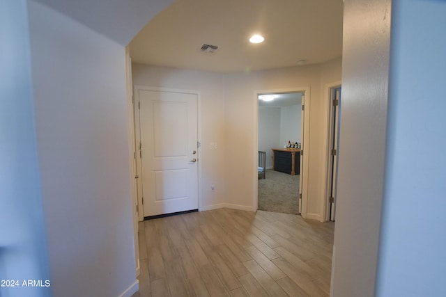 hallway with light carpet